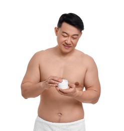 Handsome man with jar of body cream on white background