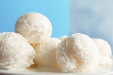 Photo of Plate with tasty vanilla ice cream, closeup