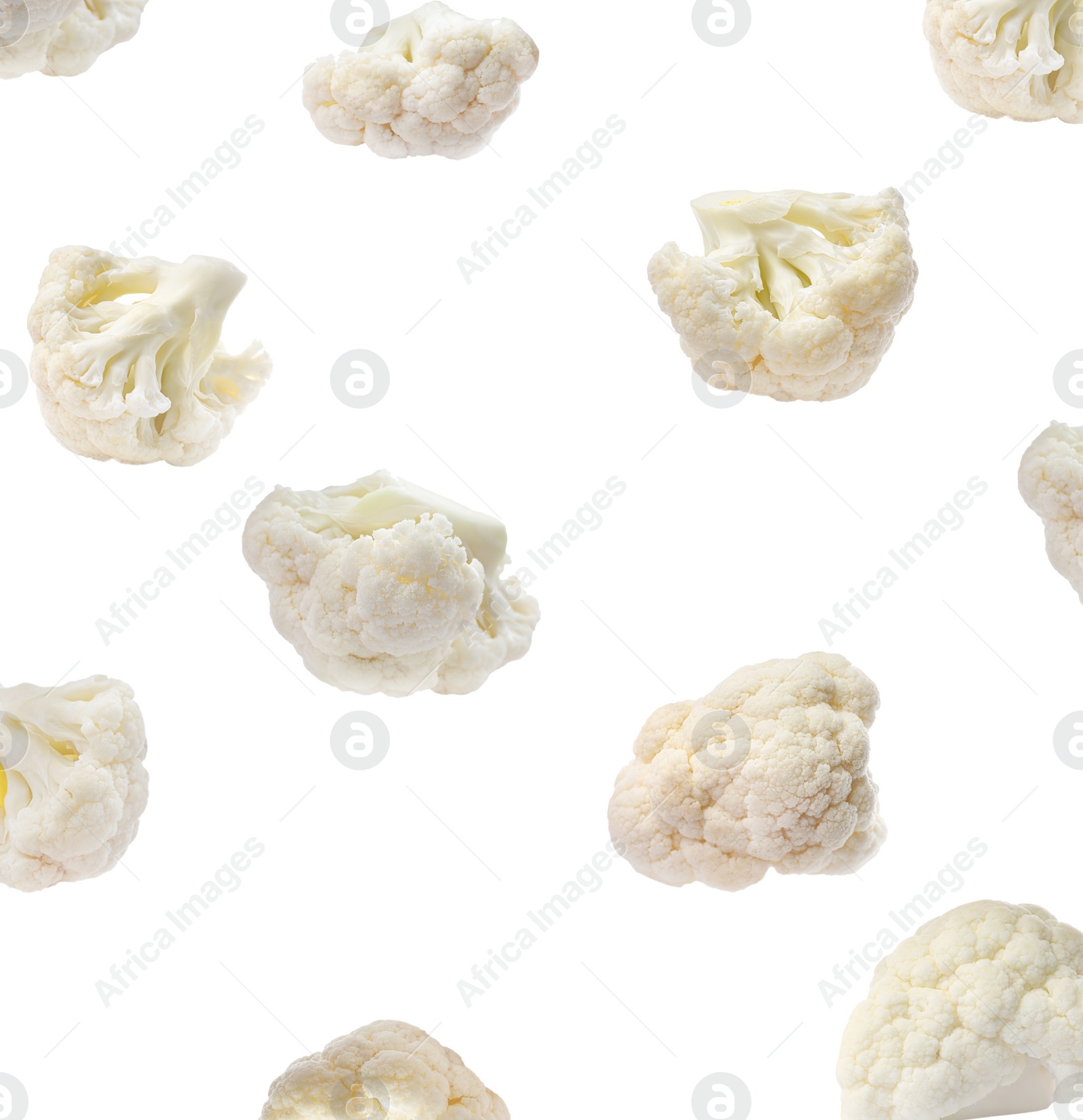 Image of Many fresh cauliflower florets falling on white background