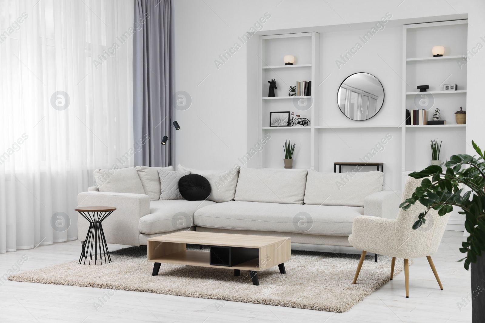 Photo of Beautiful carpet, furniture and accessories in living room