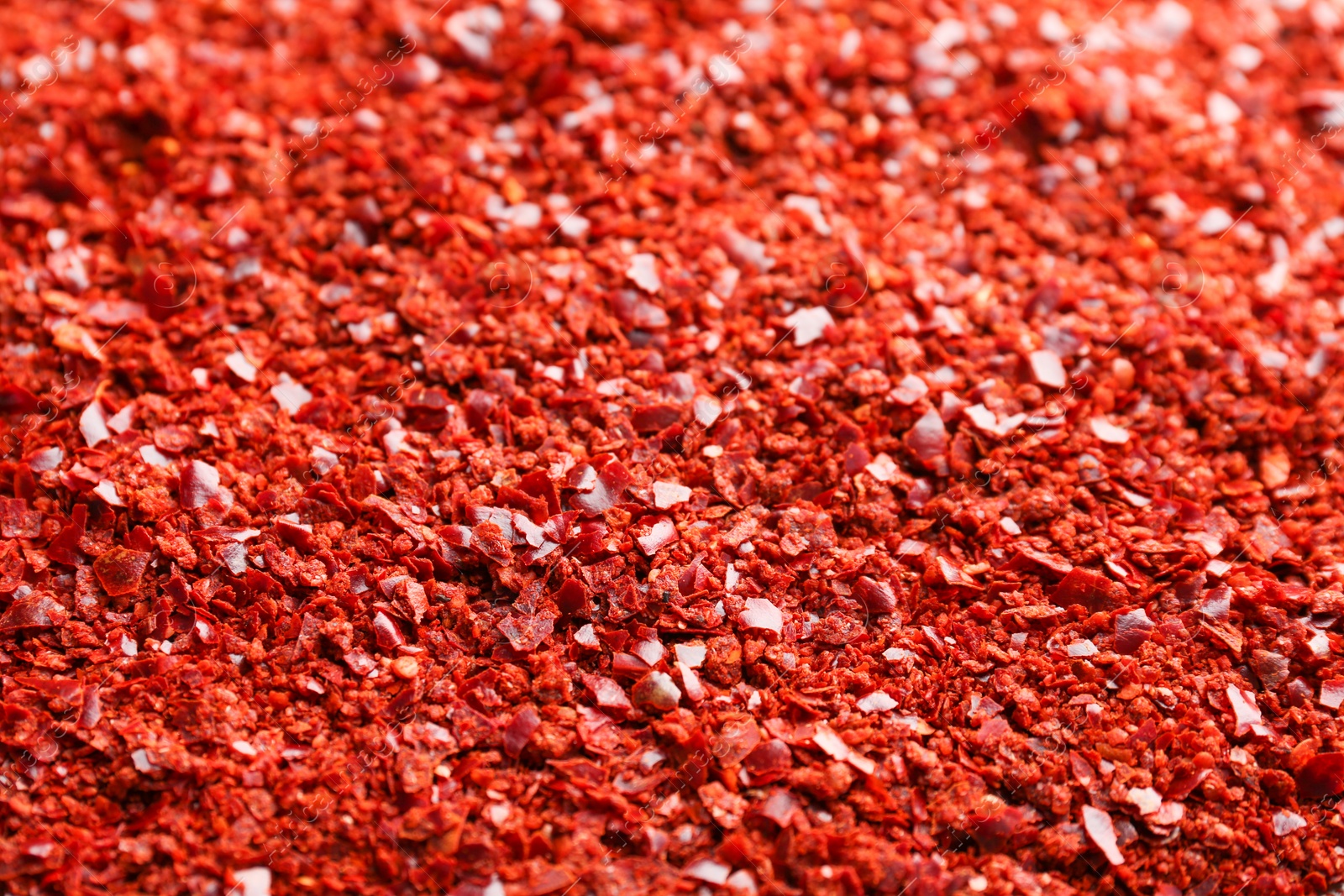 Photo of Crushed chili pepper as background