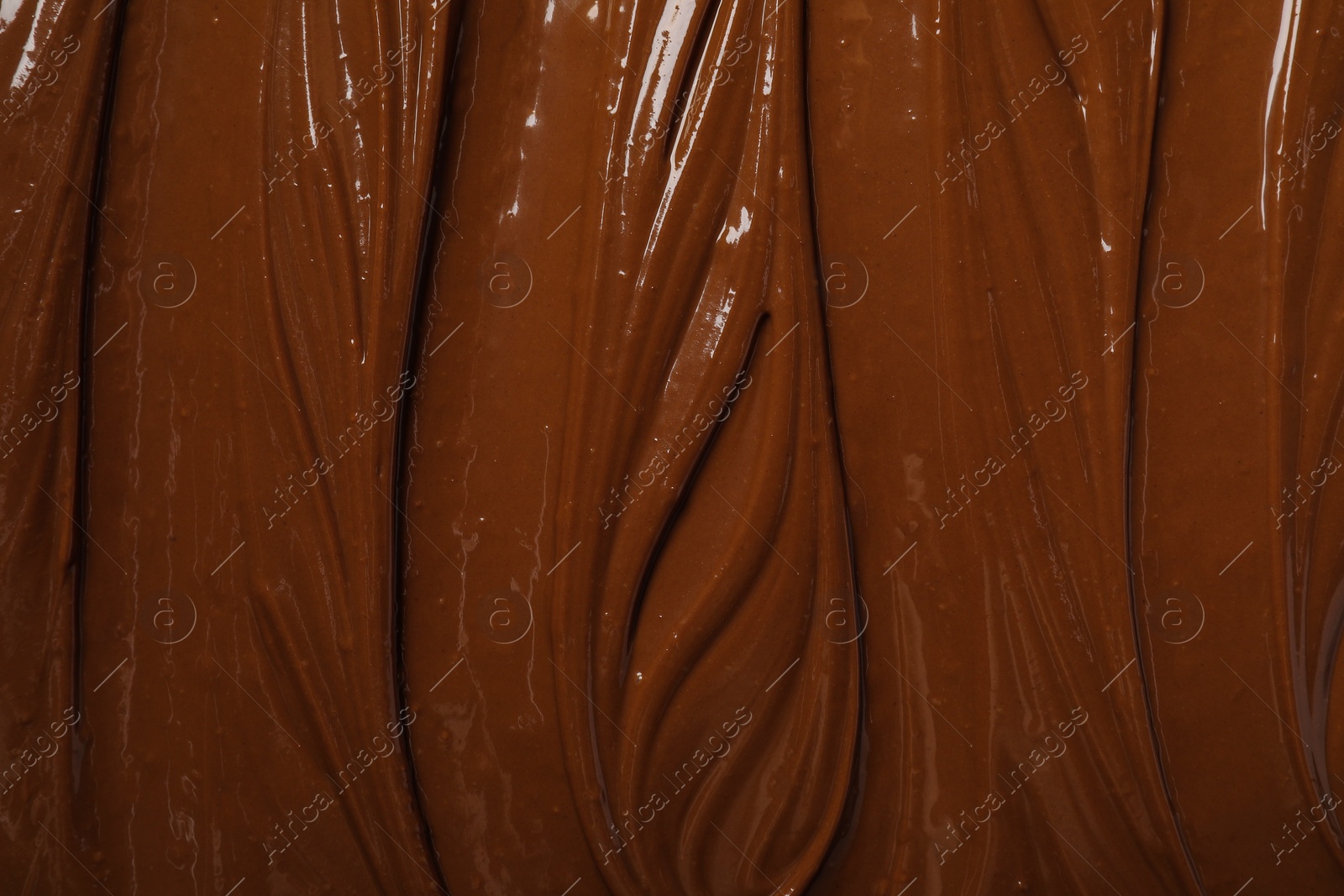 Photo of Tasty milk chocolate paste as background, top view