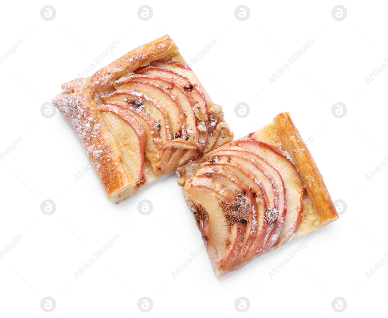 Photo of Pieces of delicious apple pie with powdered sugar isolated on white, top view