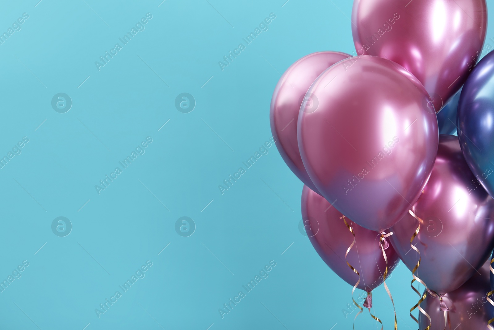 Photo of Bright balloons on color background. Space for text