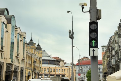 Busy city street with modern traffic lights