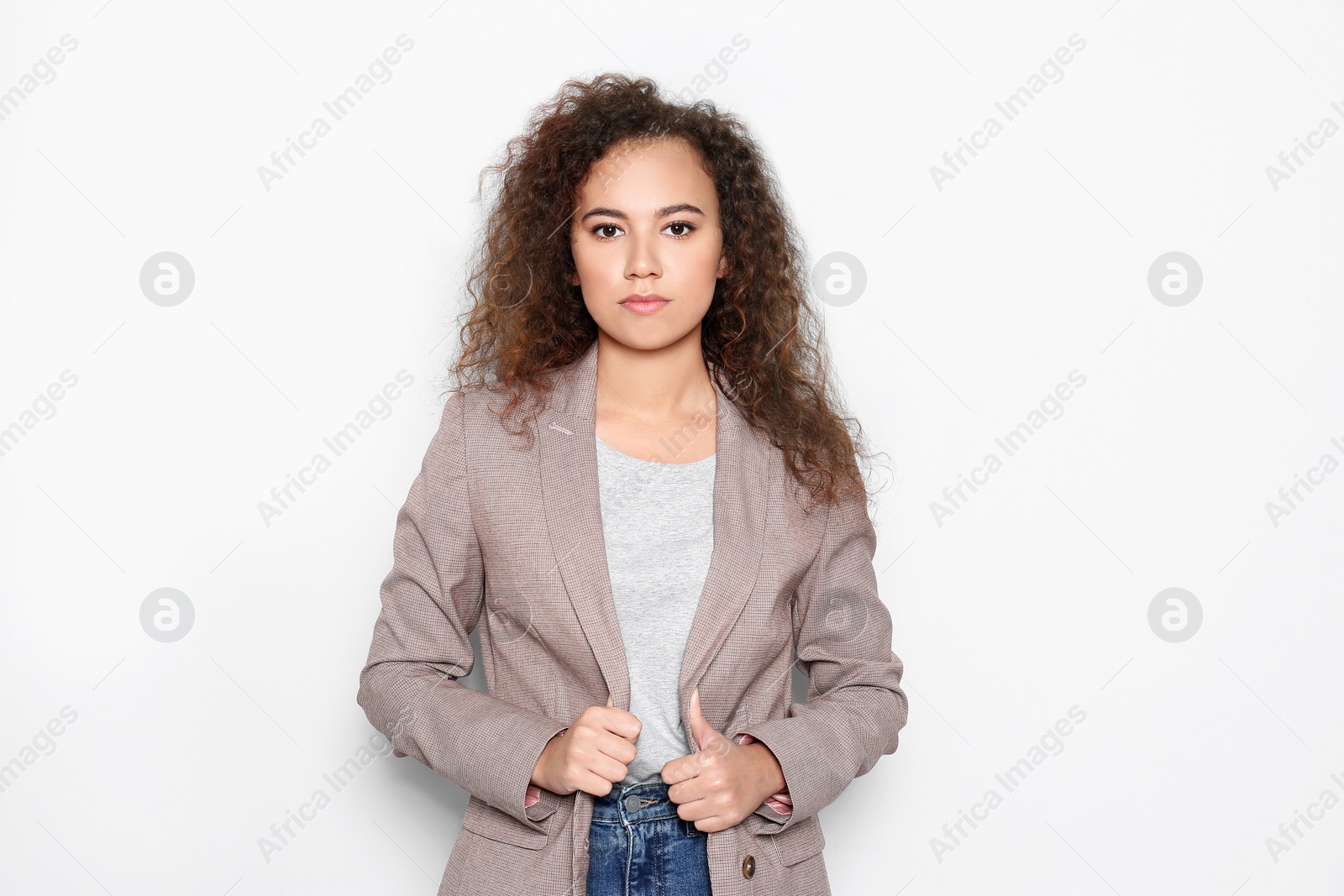 Photo of Young African-American woman with beautiful face on white background