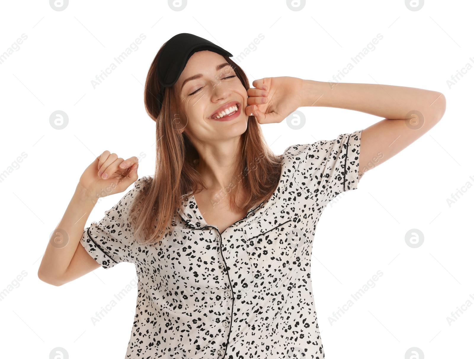 Photo of Beautiful woman wearing pajamas and sleep mask on white background. Bedtime