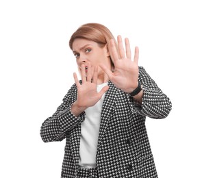 Beautiful scared businesswoman in suit on white background