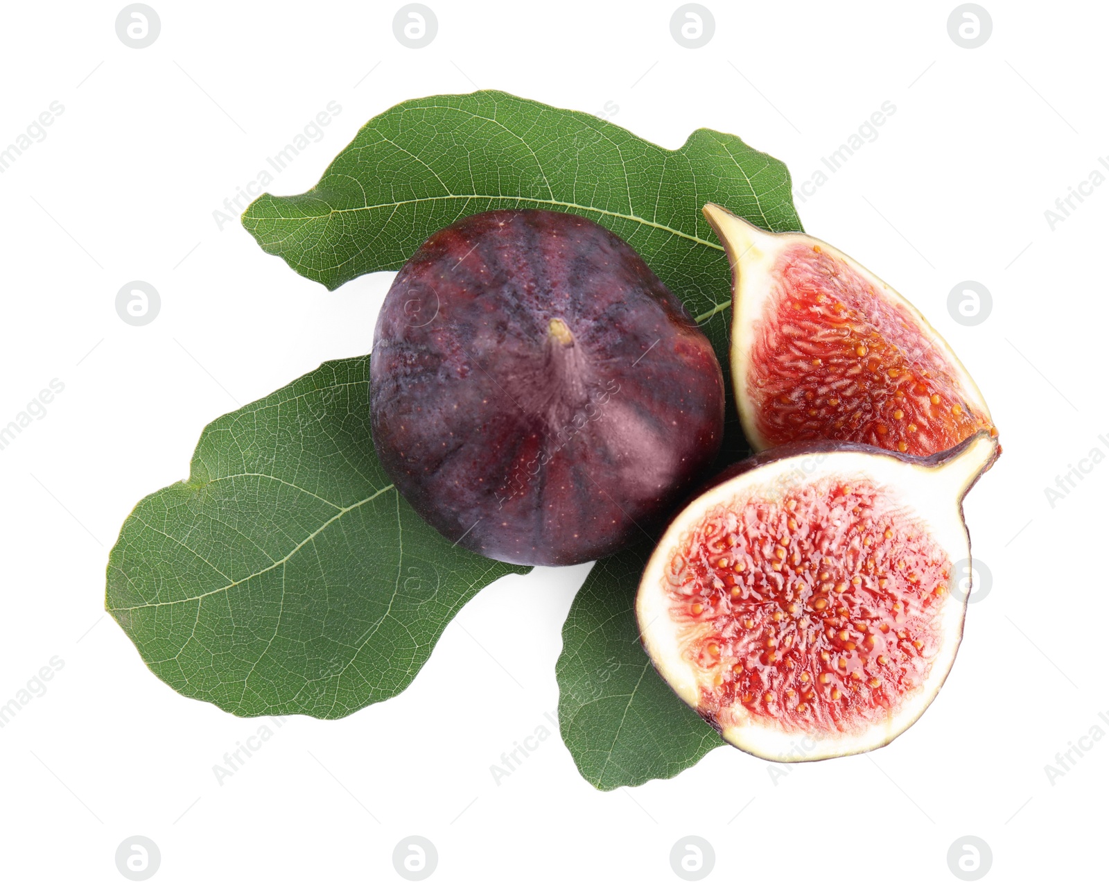 Photo of Fresh juicy purple figs and green leaves on white background, top view