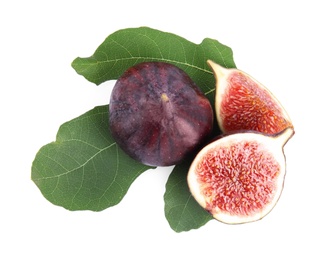 Photo of Fresh juicy purple figs and green leaves on white background, top view