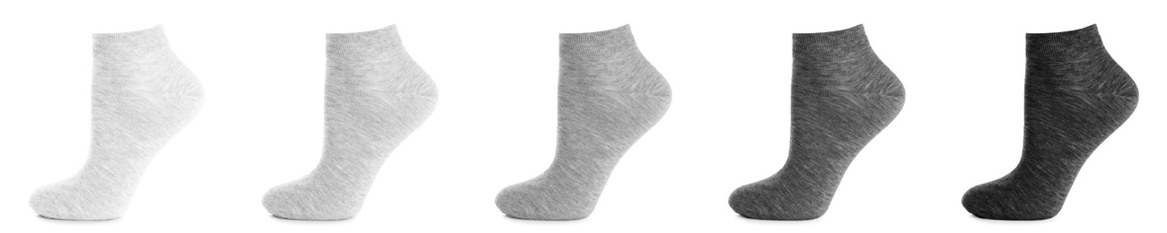 Image of Set with different socks on white background. Banner design