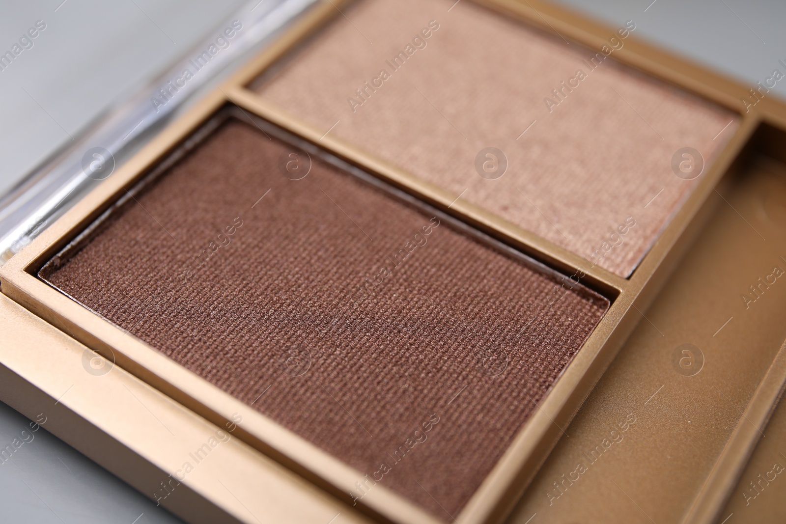 Photo of Beautiful eyeshadow palette as background, closeup. Professional cosmetic product