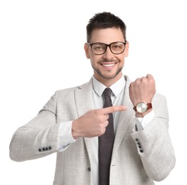 Photo of Happy businessman pointing on wristwatch against white background. Time management