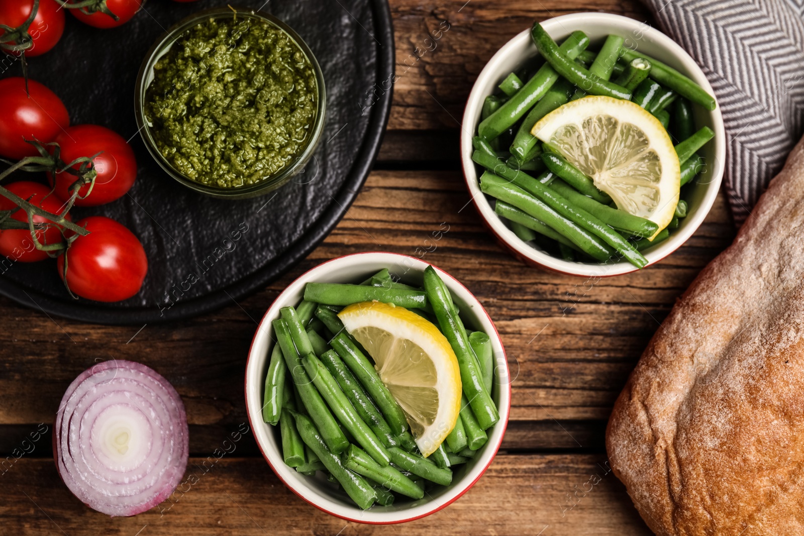 Photo of Flat lay composition with raw green beans on wooden table