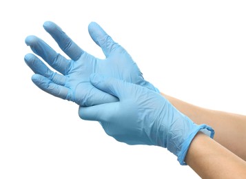 Photo of Doctor wearing light blue medical gloves on white background, closeup