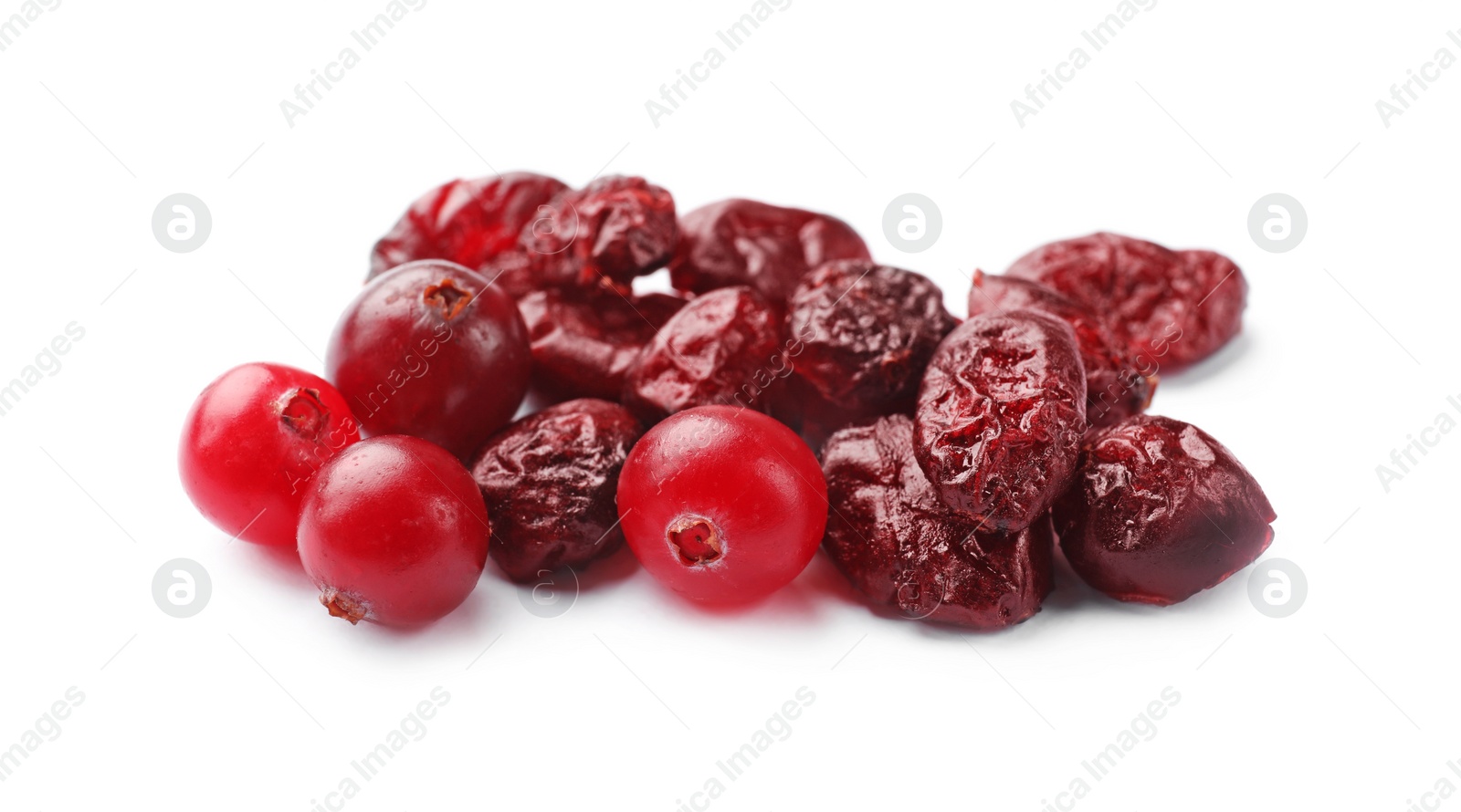 Photo of Pile of tasty dried and fresh cranberries isolated on white