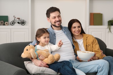 Photo of Happy family watching movie via TV at home