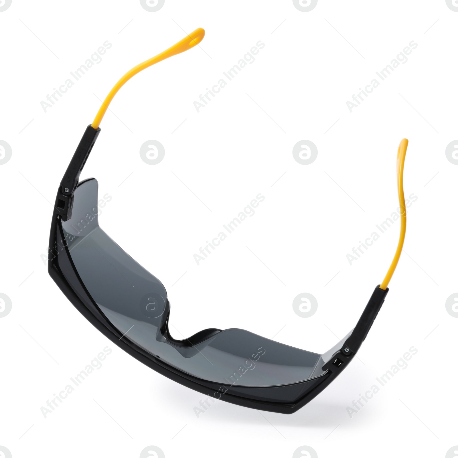 Photo of Protective goggles on white background. Construction tool