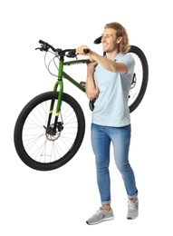 Photo of Happy young man holding bicycle on white background