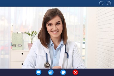 Pediatrician consulting patient online using video chat in clinic, view from webcam