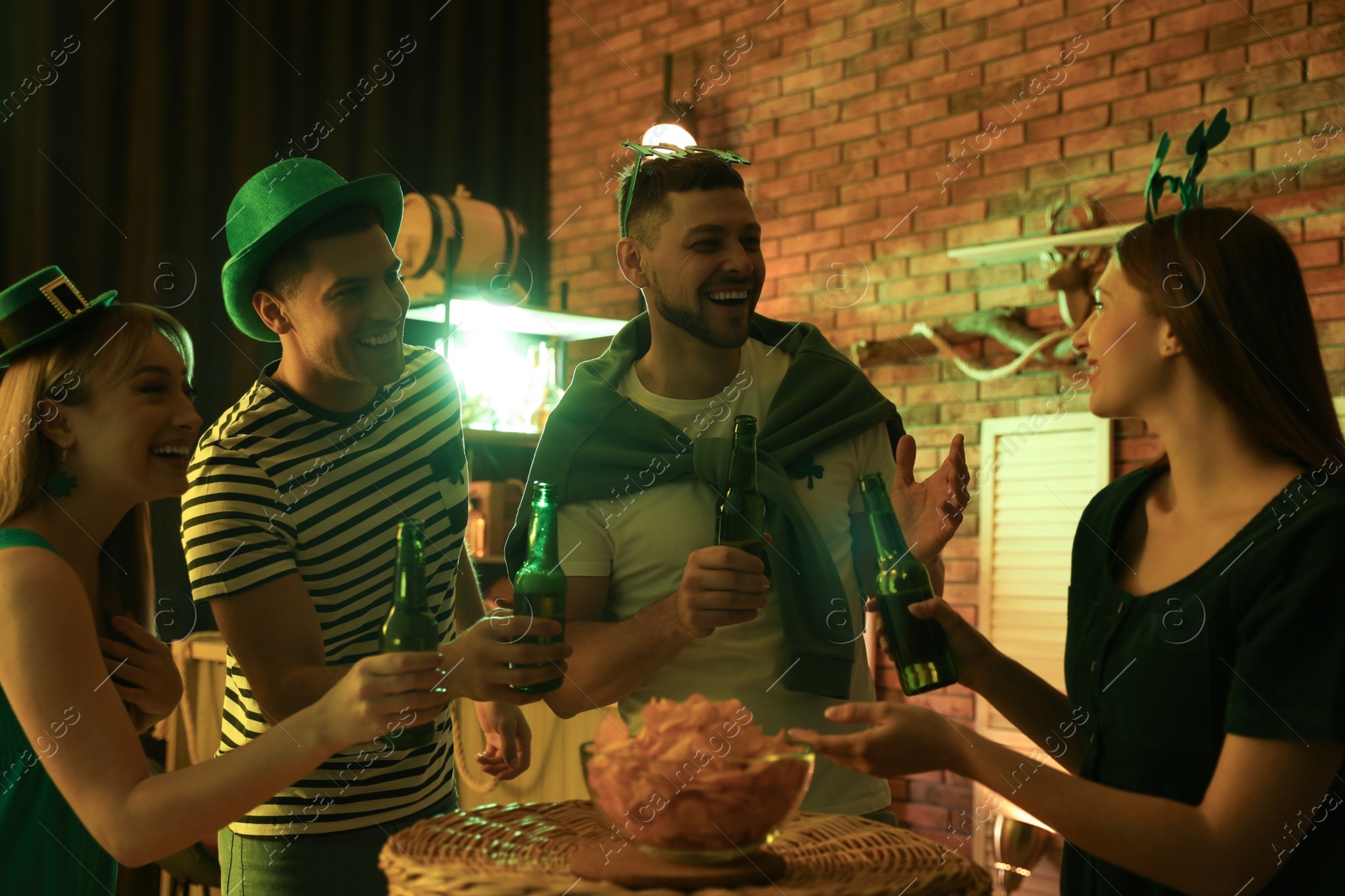 Photo of People with beer celebrating St Patrick's day in pub