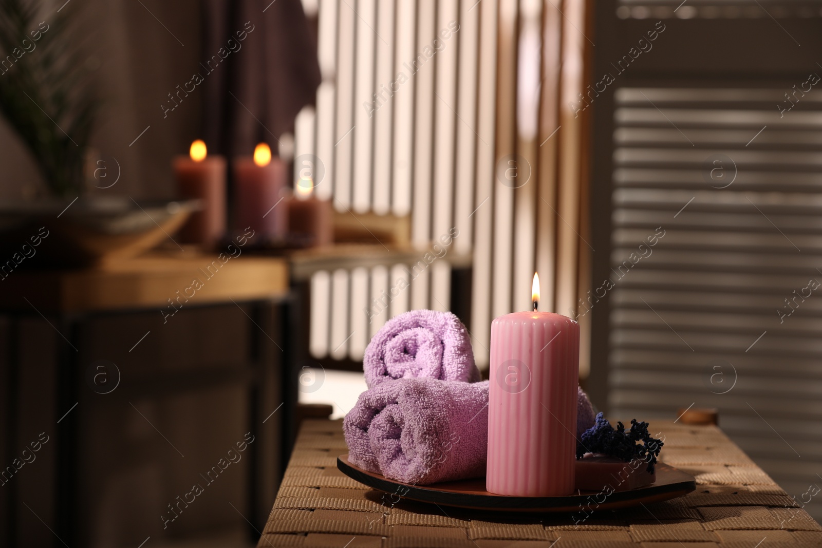 Photo of Beautiful composition with different spa products on wicker bench indoors, space for text