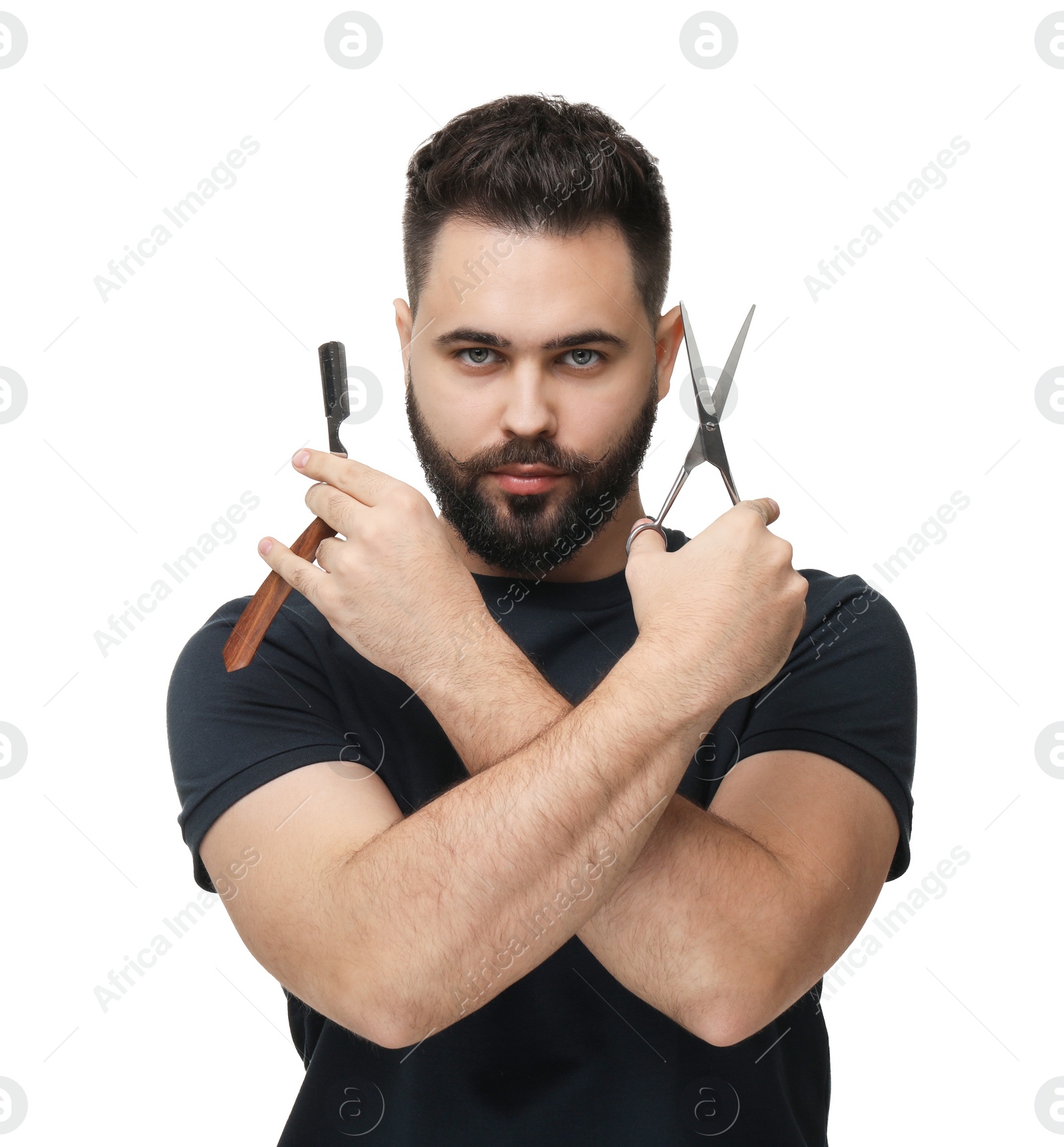 Photo of Handsome young man with mustache holding blade and scissors on white background