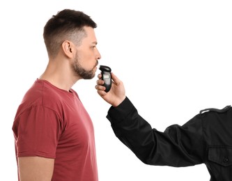 Photo of Police inspector conducting alcohol breathe testing, man blowing into breathalyzer on white background