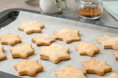 Photo of Tasty homemade Christmas cookies on baking tray