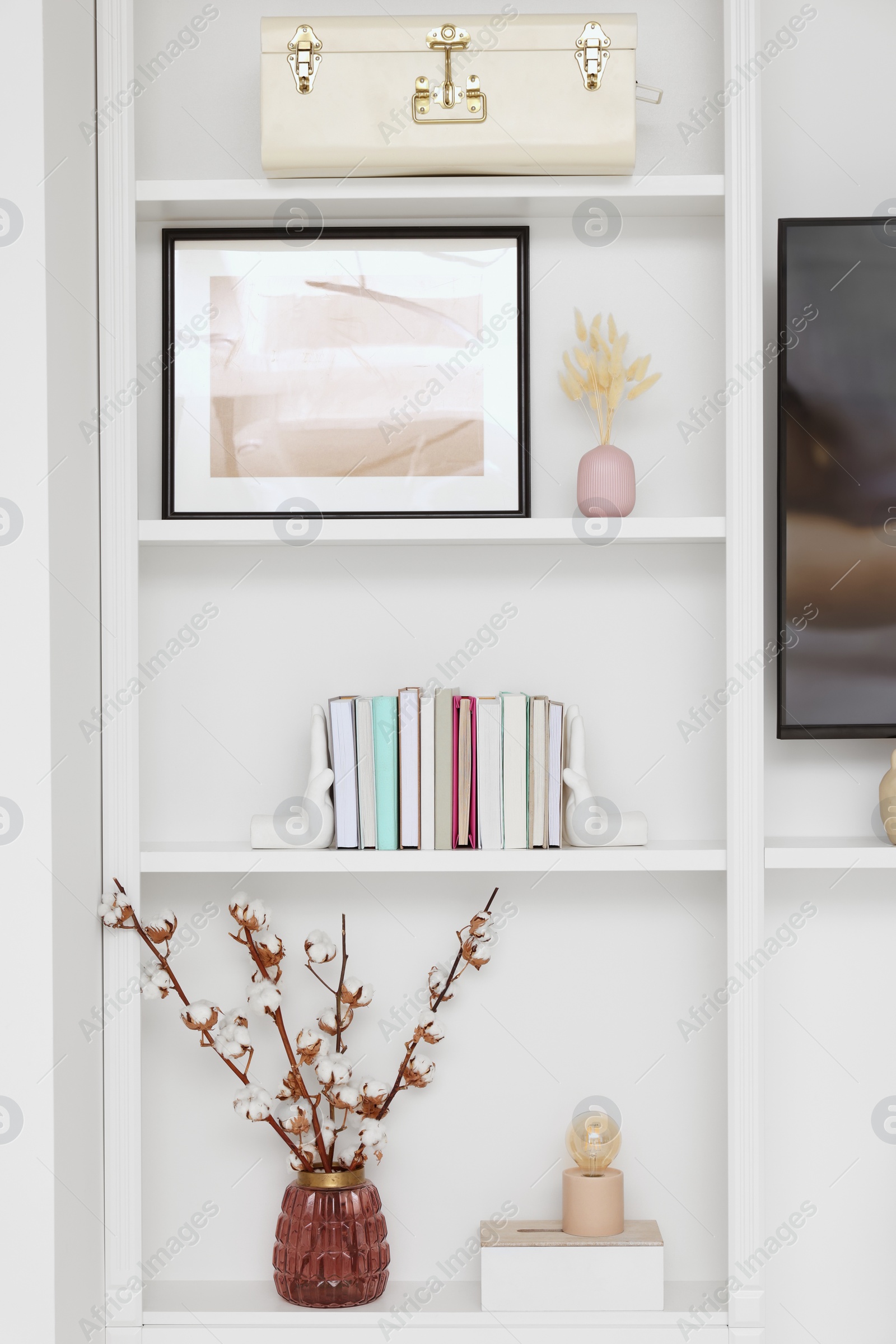 Photo of Shelves with different decor indoors. Interior design