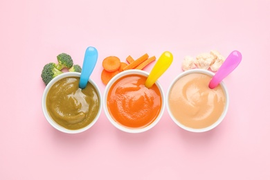 Healthy baby food and ingredients on pink background, flat lay