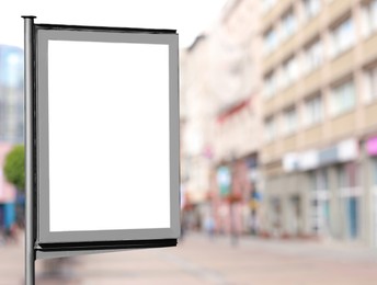 Image of Blank advertising board on city street. Space for text