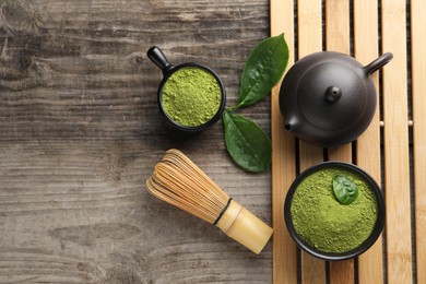 Flat lay composition with green matcha powder on wooden table. Space for text