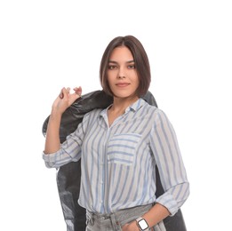 Photo of Woman holding garment cover with clothes on white background. Dry-cleaning service