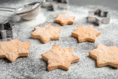 Photo of Tasty homemade Christmas cookies and flour on table