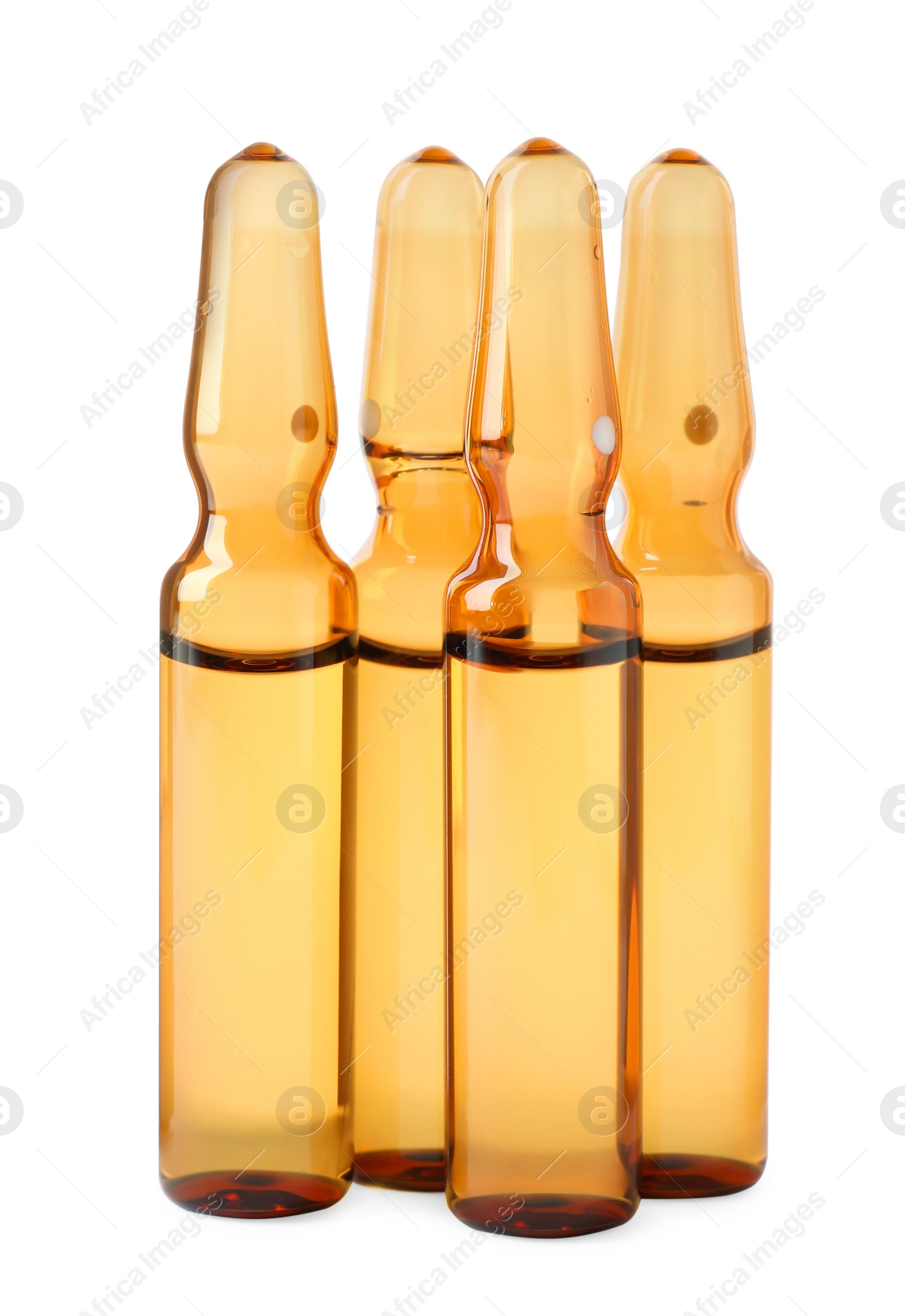 Photo of Brown pharmaceutical ampoules with medication on white background