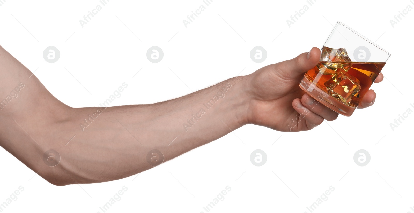 Photo of Man holding glass of whiskey with ice cubes on white background, closeup