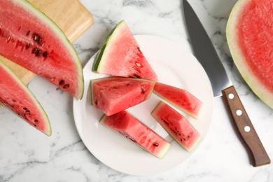 Photo of Yummy watermelon on white marble table, flat lay