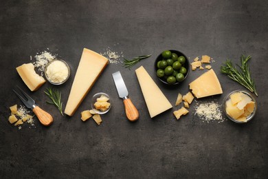 Photo of Flat lay composition with delicious Parmesan cheese on dark grey table