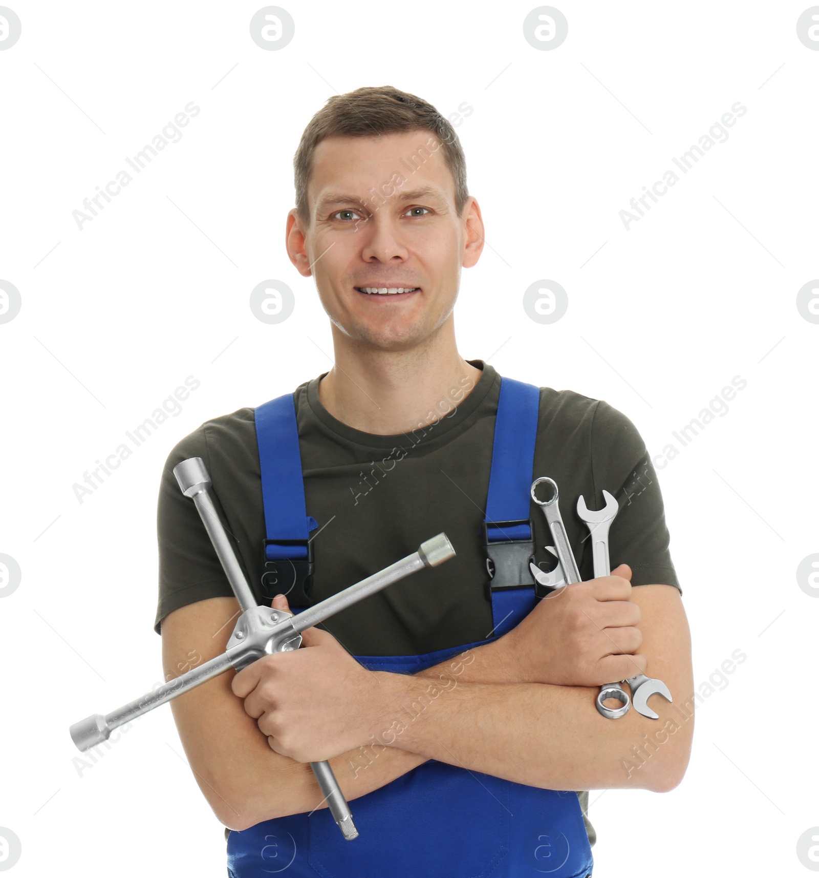 Photo of Portrait of professional auto mechanic with wrenches on white background