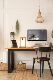 Modern workplace with computer in room. Interior design