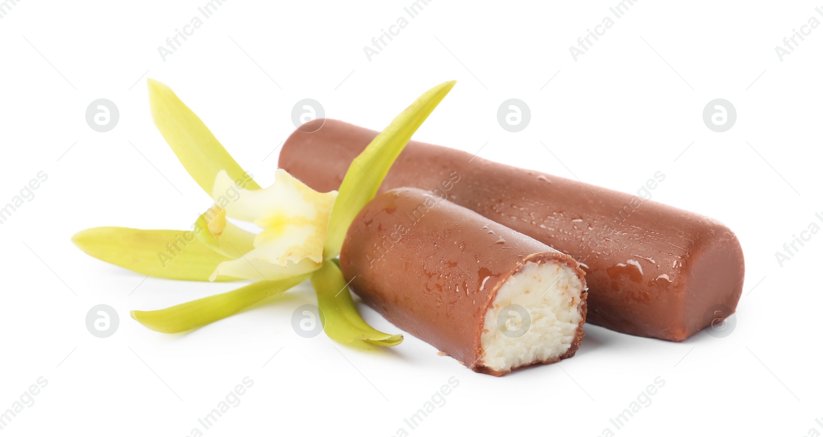 Photo of Glazed curd cheese bars and vanilla flower isolated on white