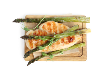 Photo of Tasty grilled chicken fillet with asparagus and sprouts isolated on white, top view