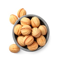 Photo of Bowl and delicious nut shaped cookies with condensed milk on white background, top view