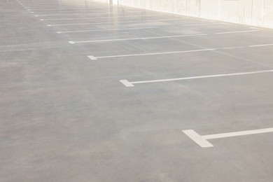 Outdoor car parking lot with white marking lines 