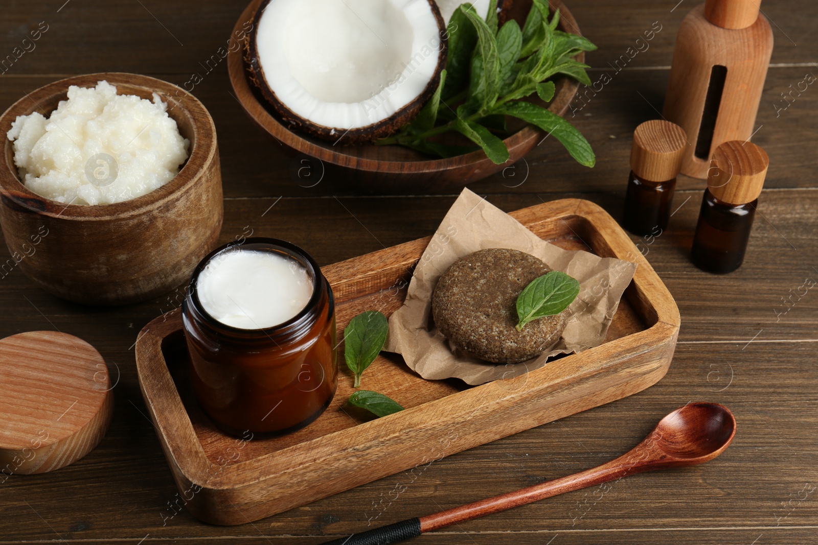 Photo of Homemade cosmetic products and fresh ingredients on wooden table, above view