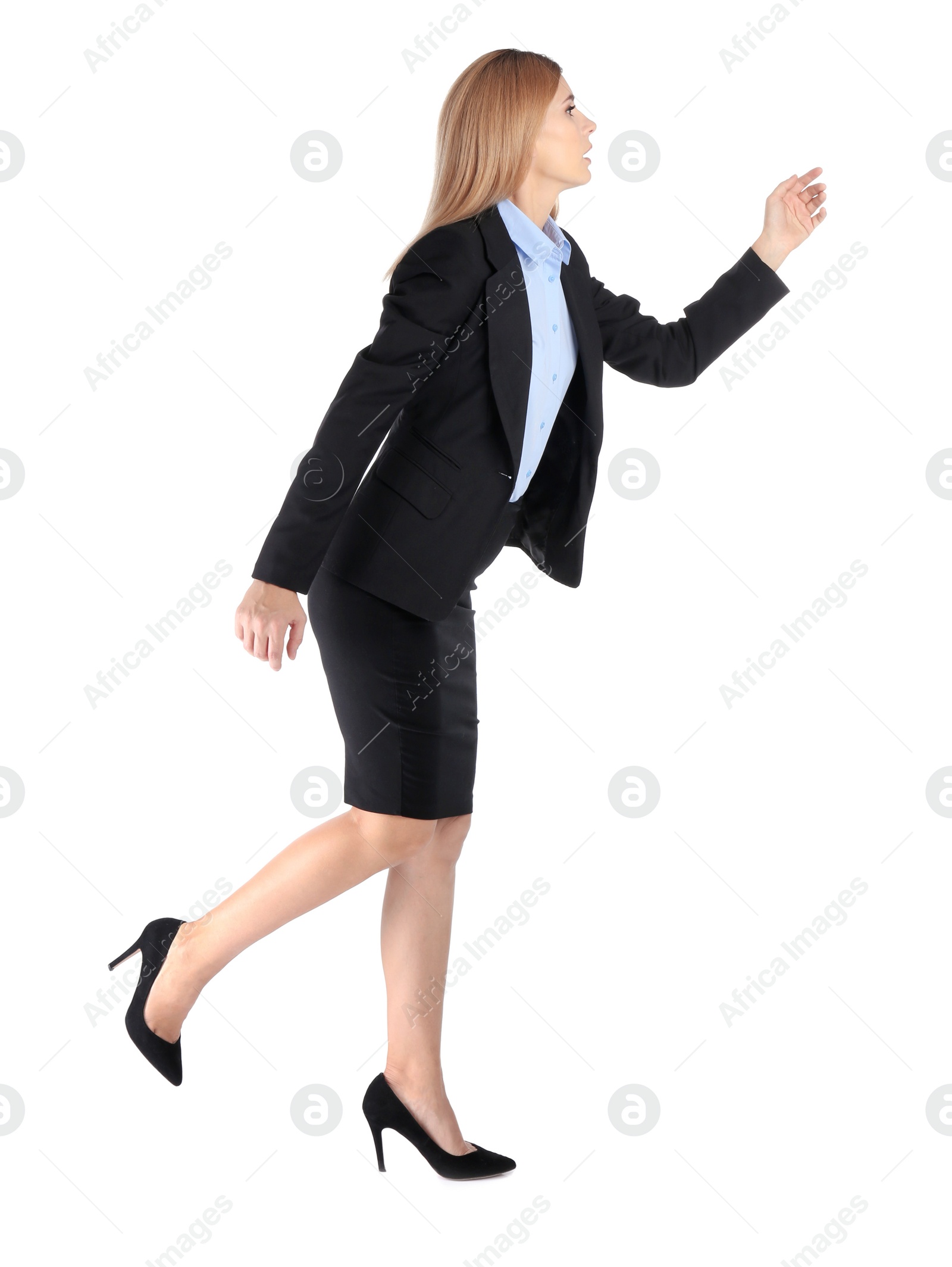 Photo of Full length portrait of businesswoman running on white background