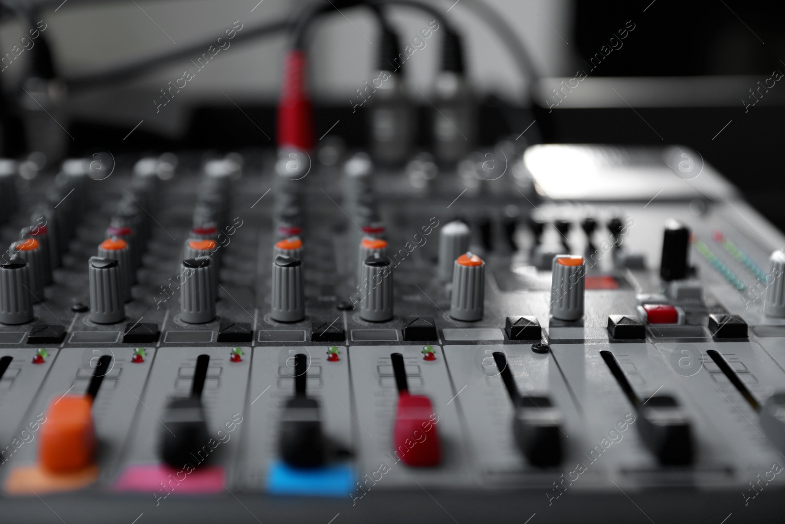 Photo of Modern audio mixing console, closeup. Music equipment