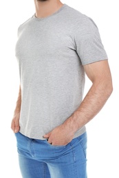 Photo of Young man in t-shirt on white background. Mockup for design