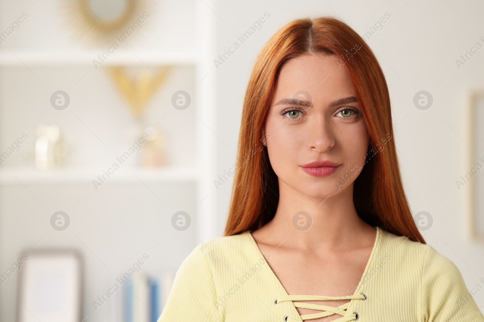 Photo of Portrait of beautiful young woman on blurred background, space for text